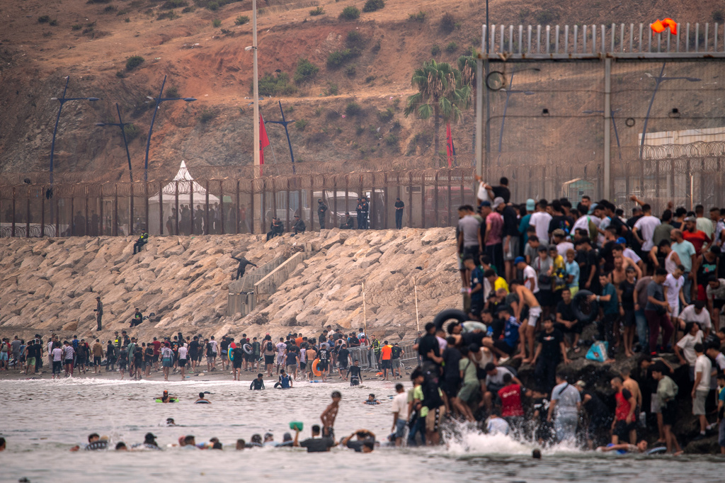 At least 18 die after thousands invade Spain from Morocco