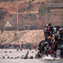 At least 18 die after thousands invade Spain from Morocco