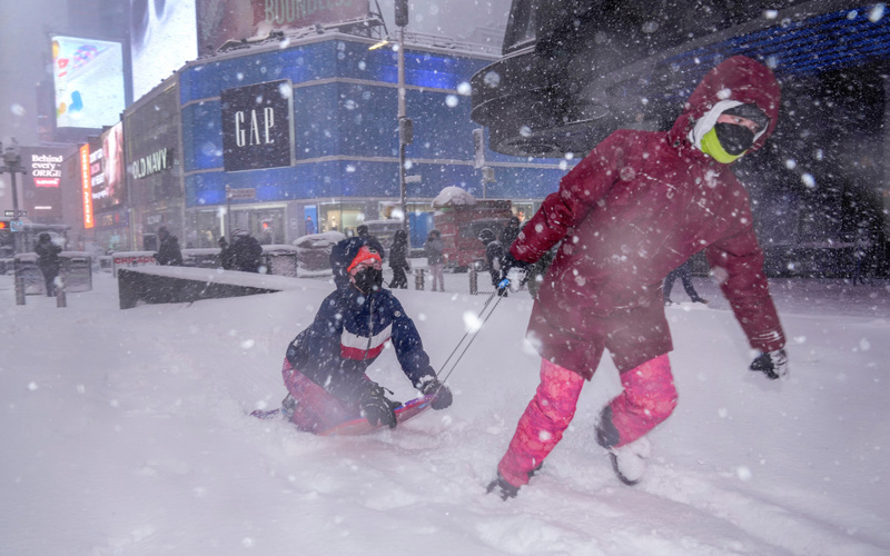 Northeast US digs out from brutal snowstorm that disrupted flights and canceled school
