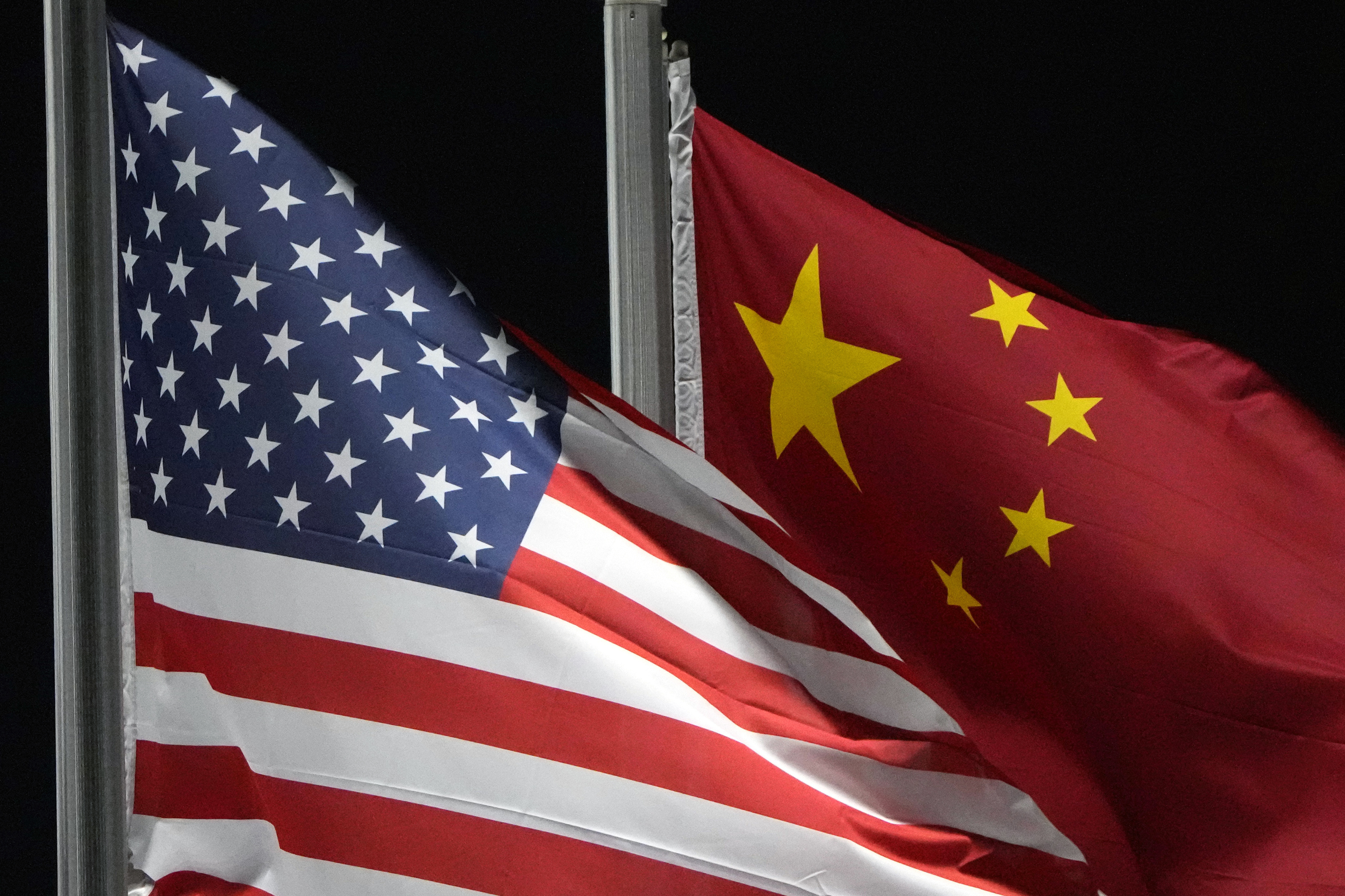 2 Chinese nationals charged with spying inside the US for Beijing