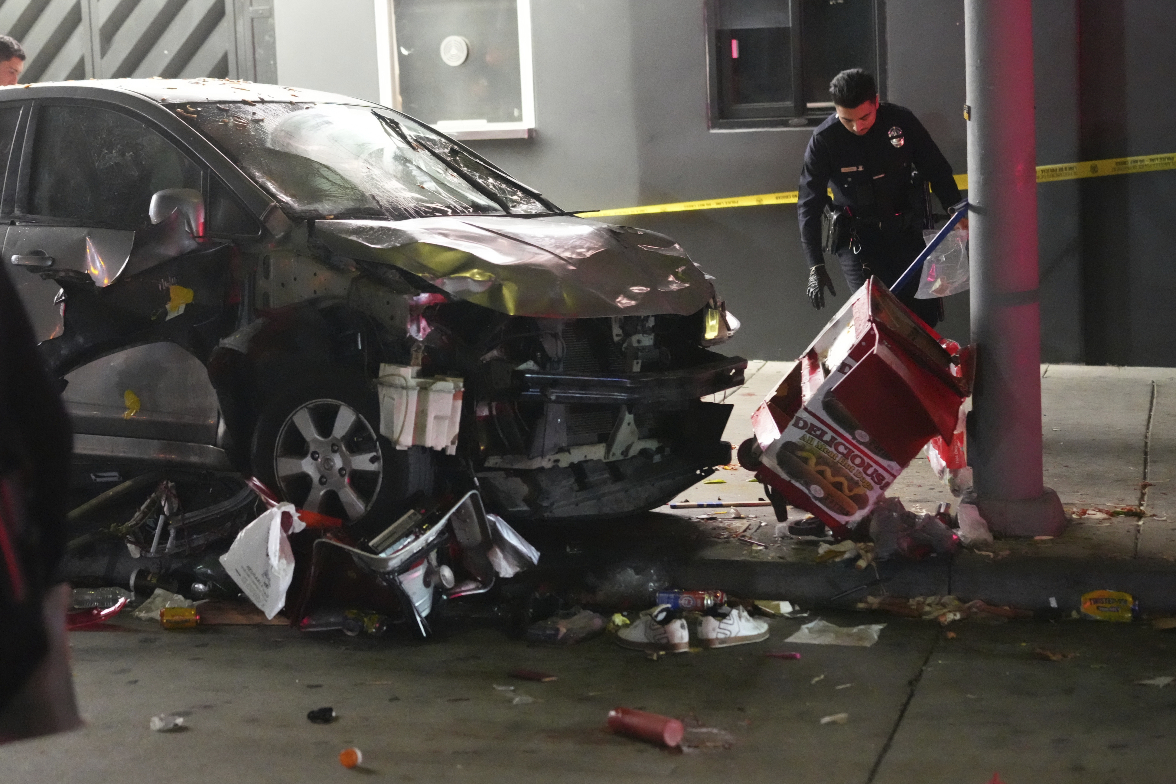 Car strikes crowd outside Los Angeles venue, injuring 30. Bystanders attack driver, who was shot