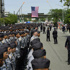 Mourners honor the NYPD officer killed in Monday's attack at NFL office