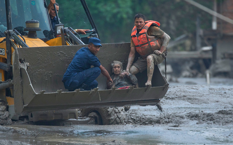At least 160 killed and hundreds missing, including Americans, after flash floods in Nepal and China