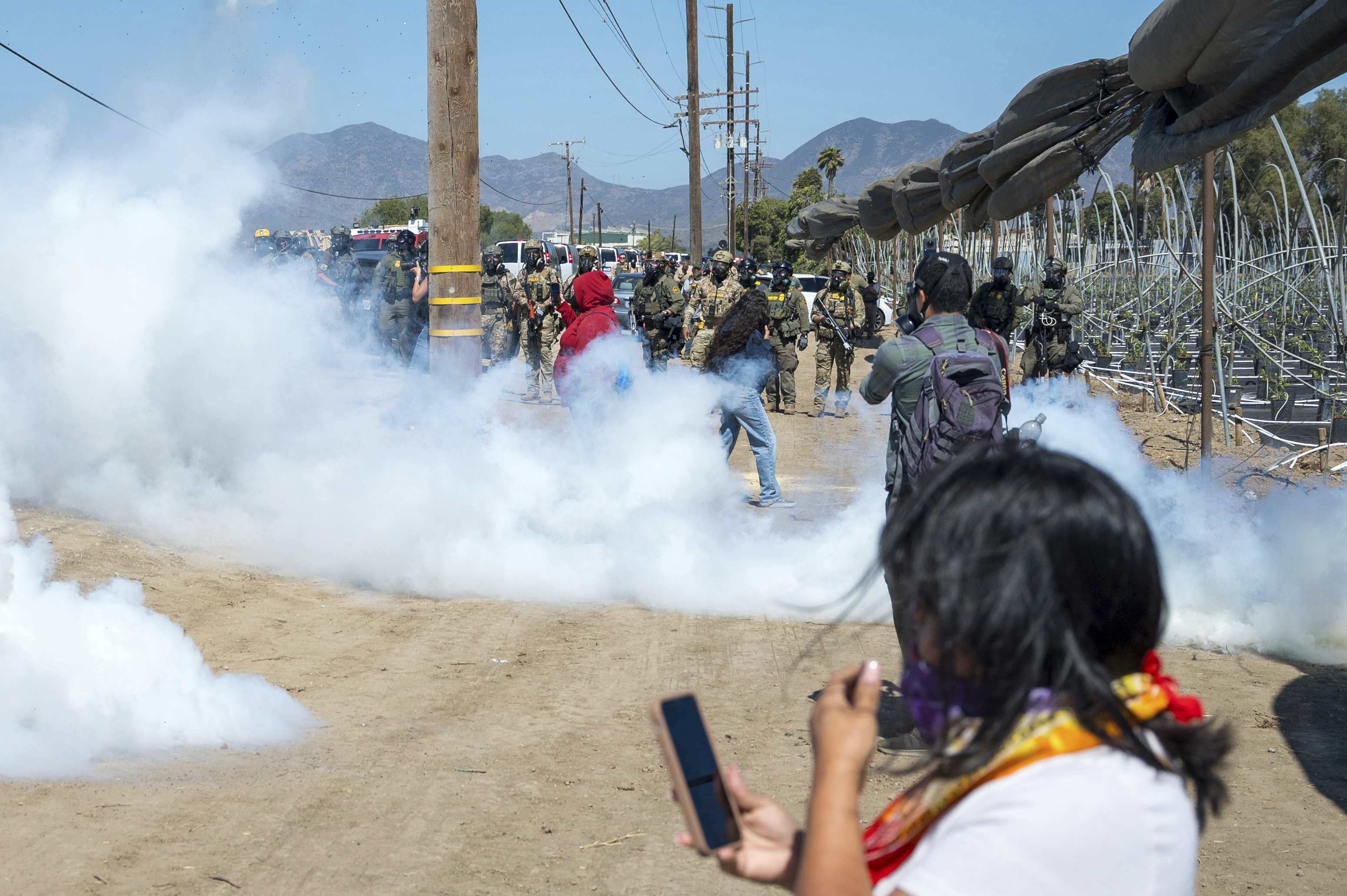 Protesters and federal agents clash during raid at Southern California farm
