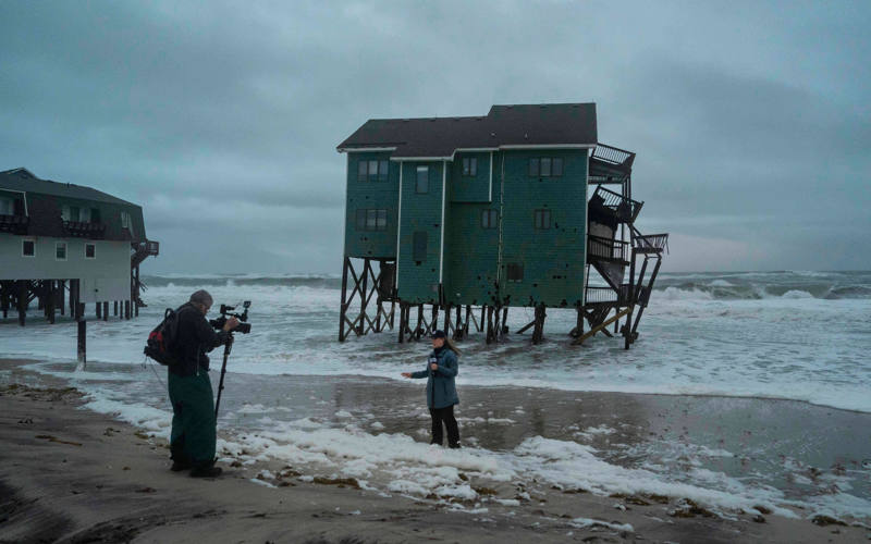 New Jersey declares emergency as nor'easter approaches, while Alaska flooding carries away homes