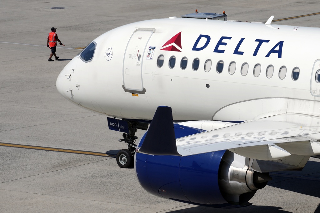 Delta flight makes emergency landing after passenger tries to open door midair