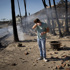 With their Los Angeles-area homes still smoldering, families return to search the ruins for memories