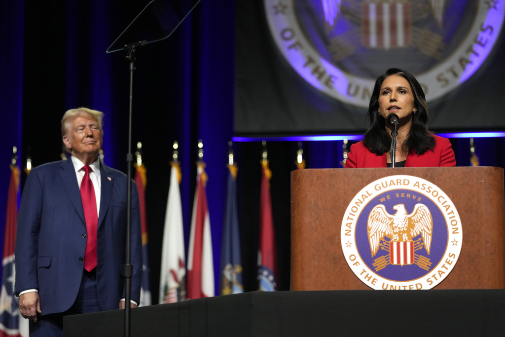 While Harris touts middle class background, Trump lures Gabbard to 'party of the people'