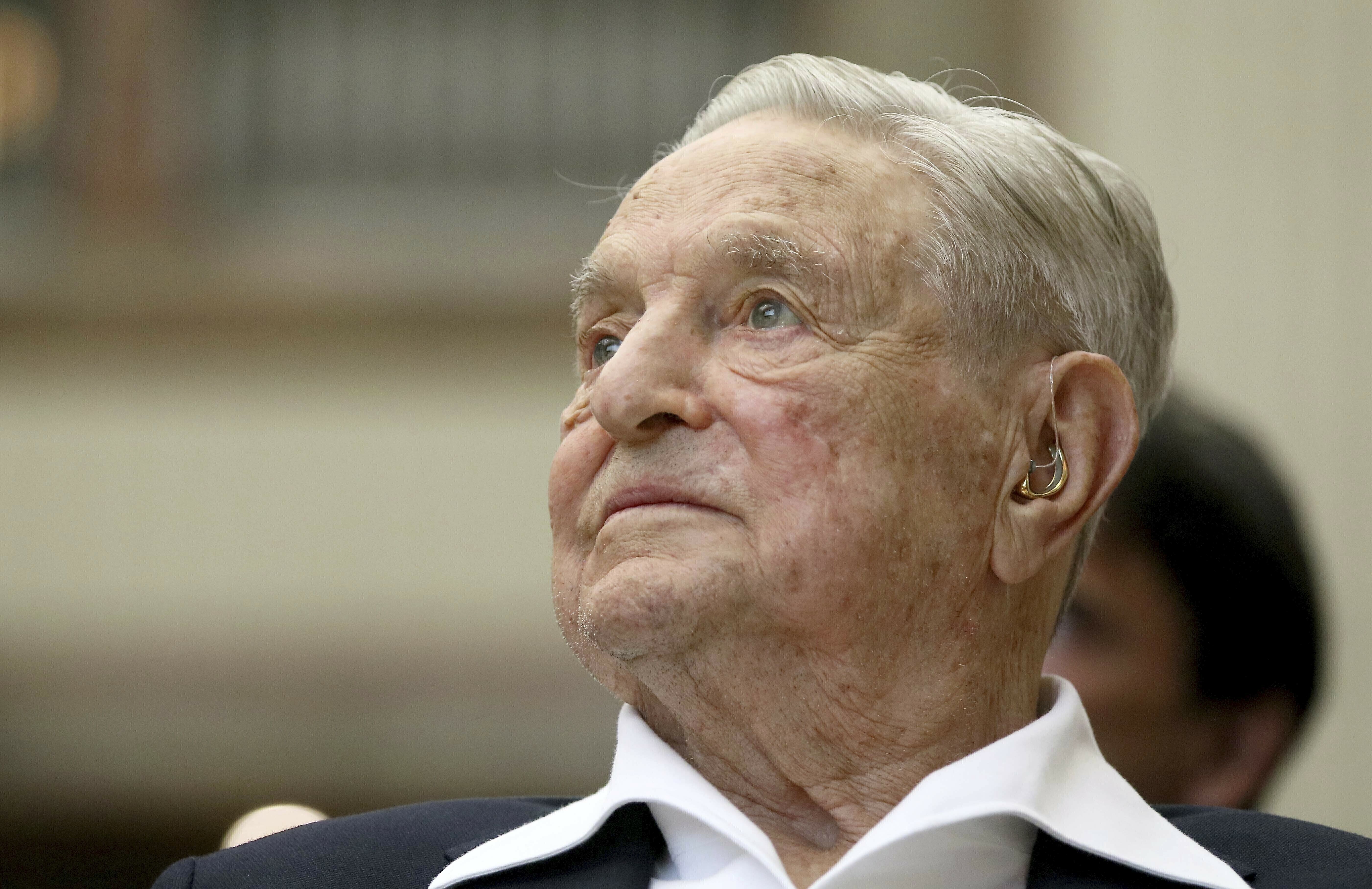 George Soros, fake philanthropist and destroyer of cities, passes flame thrower to son